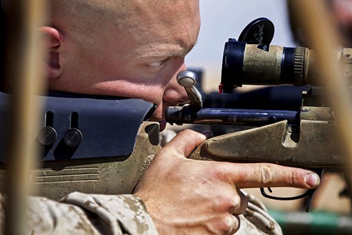 man using tactical scope